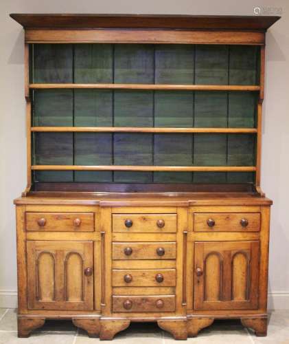 * A George III oak and fruitwood dresser, the high back with...