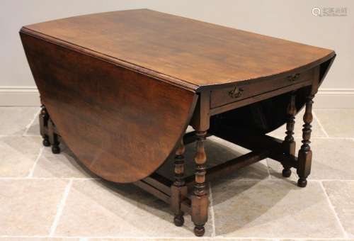 * An 18th century style oak drop leaf table, late 20th centu...