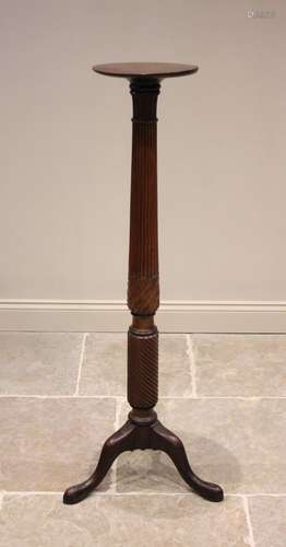 A 19th century mahogany torchere, the circular top raised up...