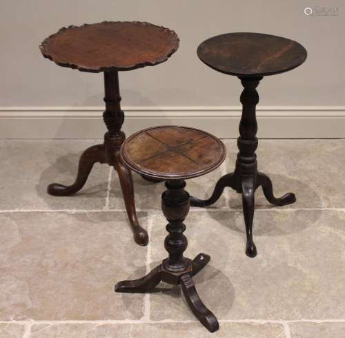 A 19th century mahogany pie crust tripod table, the circular...