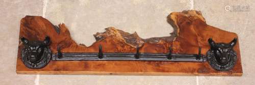 * A wall mounted cast iron and yew wood hat/coat rack, the r...