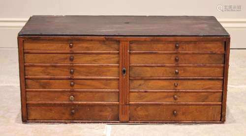 An Edwardian and later walnut specimen chest, formed from te...