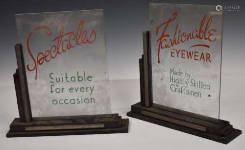 Two Art Deco style opticians shop display signs, one adverti...