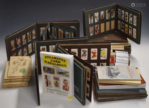 A collection of twelve cigarette card albums, mainly 1920s a...