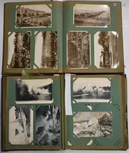 Approximately 280 cards in two Edwardian postcard albums to ...