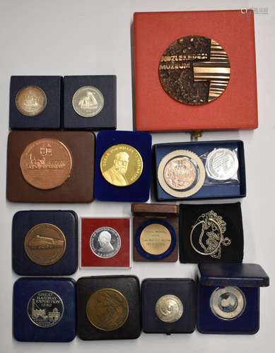 A collection of cased commemorative medallions including rai...