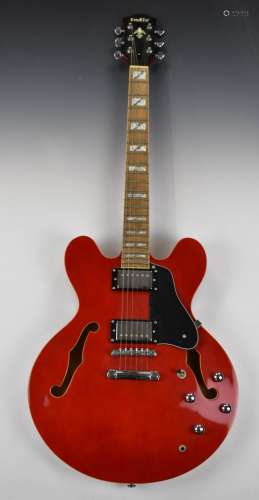 Indie semi acoustic jazz style guitar with candy red lacquer...