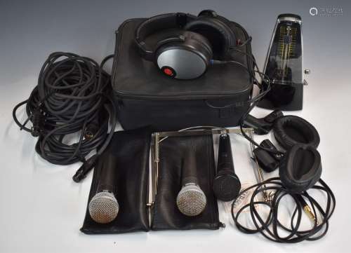 Three microphones comprising two Shure SM58 and Peavey with ...