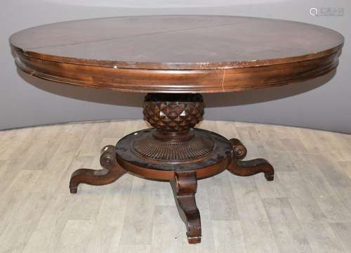 Circular mahogany extendable dining table with carved suppor...