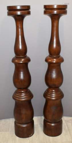 A pair of turned mahogany jardinière stands or torcheres, di...