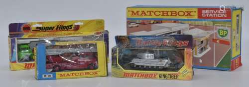 Four Matchbox diecast model vehicles and accessories Super K...