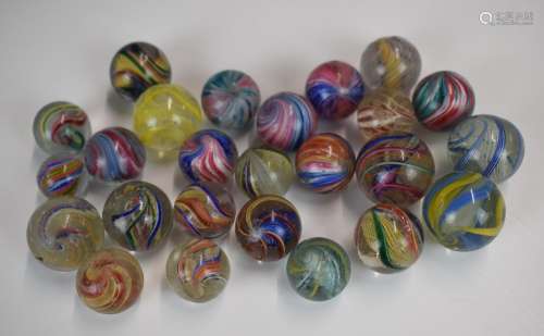 Twenty-five glass marbles all with multi-coloured latticino ...