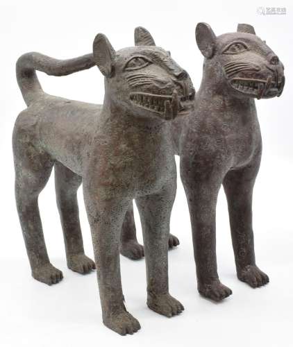 Pair of Beninbronze large cats/ leopards with textured decor...