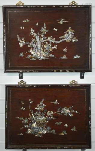 A pair of rosewood mother of pearl and abalone inlaid wall p...