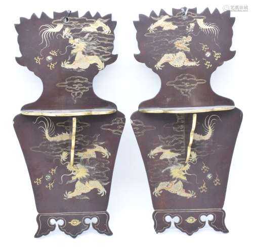 A pair of Japanese Meiji period lacquer wall brackets with f...