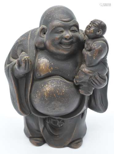 Chinese ceramic Buddha holding a child, 18cm tall