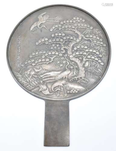 Japanese large bronze mirror with relief moulded decoration,...