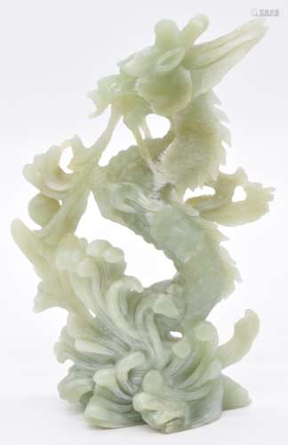 Chinese jade or similar hardstone carving of a dragon surrou...