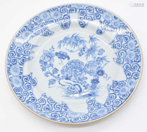 Chinese 19thC blue and white plate decorated with flowers an...