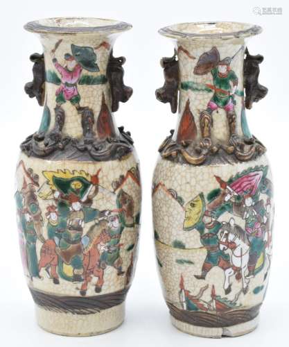 A pair of Chinese crackle glazed vases decorated with battle...