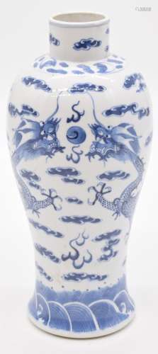 Chinese 19thCblue and white vase decorated with dragons chas...