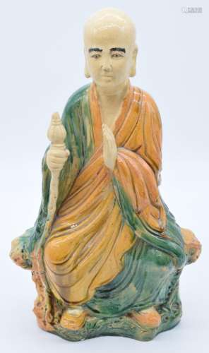 Chinese pottery polychrome figure of a monk, with impressed ...