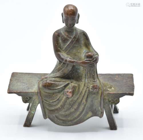 Tibetan 19thCbronze of a Buddhist monk on a bench, 6.8cm tal...