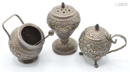 Indian or Burmese silver cruet items with embossed decoratio...