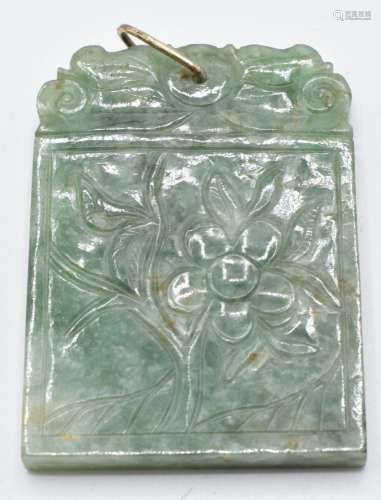 A carved jadeite pendant/ plaque depicting flowers, 4.5 x 3....