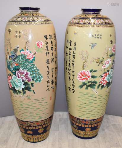 A pair of Japanese ceramic floor vases with peacock, peony a...