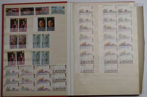 A collection of mint Jersey and Guernsey stamps in five stoc...