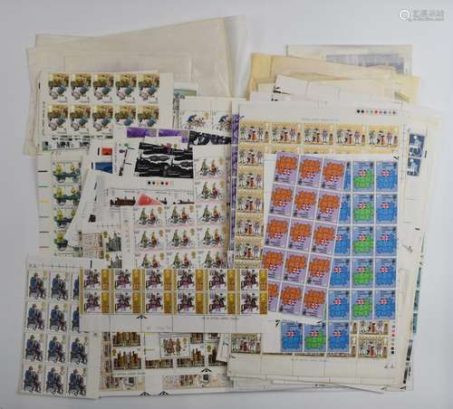 A large quantity of loose mint GB QEII stamps, includes many...