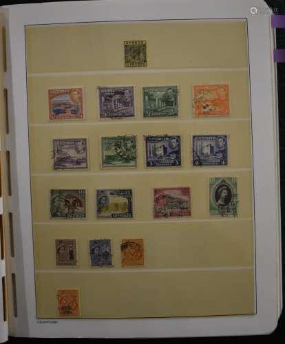A collection of mint and used stamps from Cyprus in a green ...