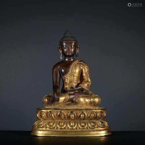 A gilt-bronze statue of Sakyamumi