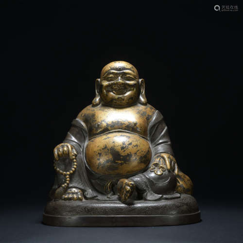 A bronze statue of Maitreya Buddha