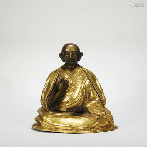 A gilt-bronze statue of Guru