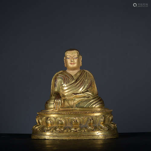 A gilt-bronze statue of Guru