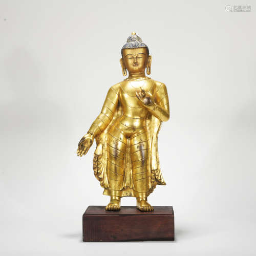 A gilt-bronze sitting buddha