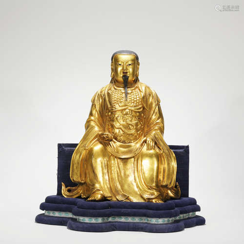 A gilt-bronze statue of Guanyu