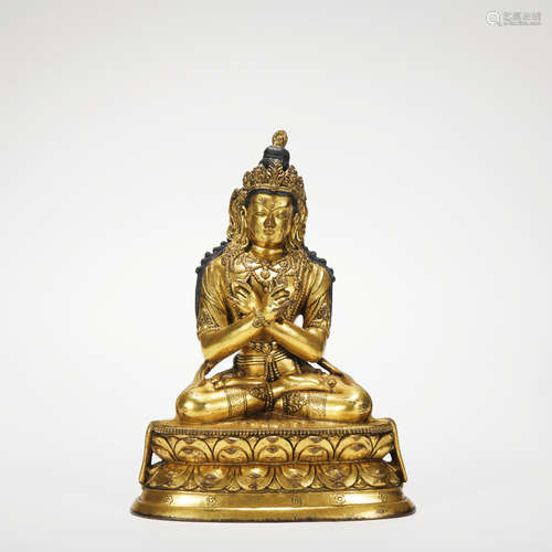 A gilt-bronze statue of Vajrasa hammer