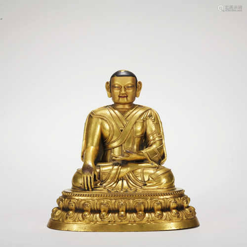 A gilt-bronze statue of guru