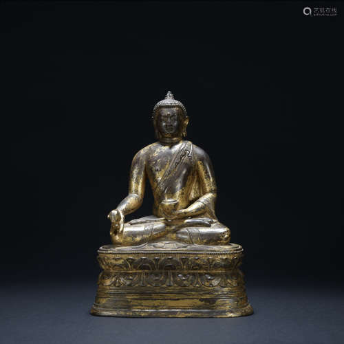 A gilt-bronze statue of Pharmacist Buddha