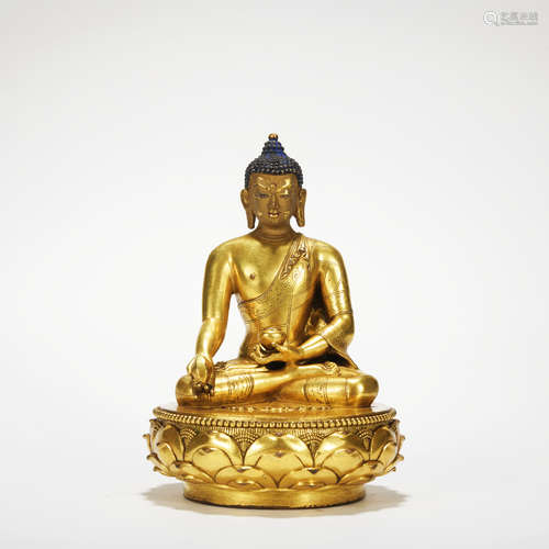 A gilt-bronze statue of Pharmacist Buddha