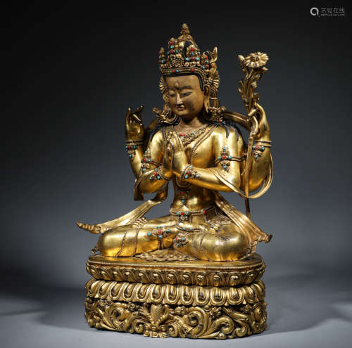 In the Ming Dynasty, the bronze gilded four arm Guanyin sitt...