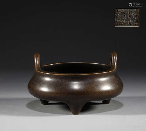 In the Ming Dynasty, the bronze three legged two ear censer