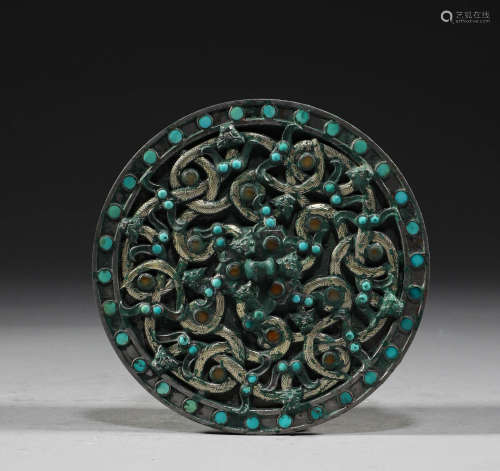 In the Han Dynasty, bronze mirror inlaid with silver and pin...
