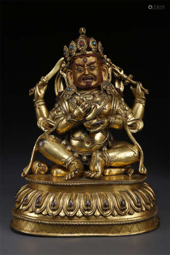 A Gilt Copper Four-Arm Mahakala Buddha Statue.
