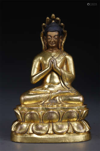 A Gilt Copper Vairocana Buddha Statue.