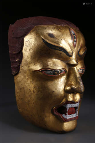A Gilt Copper Mask.