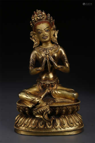 A Gilt Copper Buddha Statue.